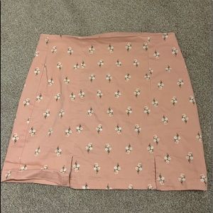 Pink skirt with daisy’s on them